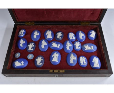 A collection of jasperware relief plaques, the largest 6.5cm x 4cm, the associated Victorian rosewood rectangular box inlaid 