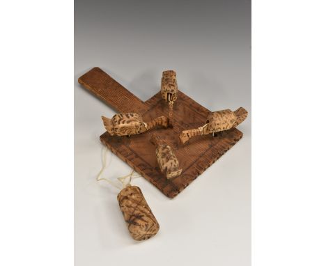 Folk Art - an early 20th century softwood and pyrography automaton toy, the bat shaped plateau with four weighted model chick