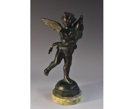 Continental School (early 20th century), a verdigris patinated bronze, of a putto clutching a dolphin, domed socle, marble ba