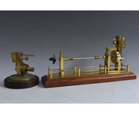 A brass and steel engineer's working model, of a turbine, 33.5cm wide; another, Engine 002, Feb 1998, plinth base, (2)  