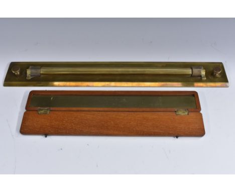 A 19th century brass draughtsman's barrel ruler, by J Davis & Son Derby, 46cm wide; another ruler, Standard Foot, Engine Divi