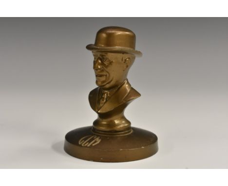 An advertising desk weight, cast with a portrait bust and inscribed to the underside G Clifford Morris, Evington House, Cromp