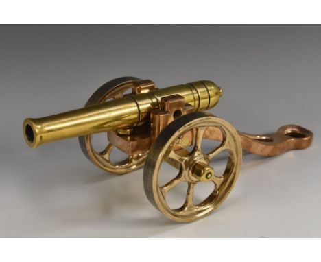 An early 20th century polished bronze desk model signal canon, 19cm barrel with touch hole, 30cm long overall