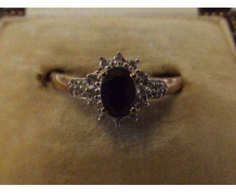 9 carat gold dress ring set with black sapphire and diamond cluster (Size O)