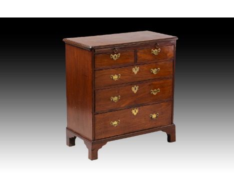 A small George II Cuban mahogany bachelor's chest of two short over three long drawers, the top with moulded re-entrant top a