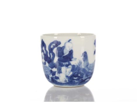 A Chinese blue &amp; white chicken cup, Qing, painted with a boy and chicken between rocks and blossoming peony, with six cha