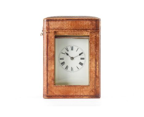 An early 20th-century corniche cased repeating 8-day carriage clock with folding bale handle and simple white enamel roman di