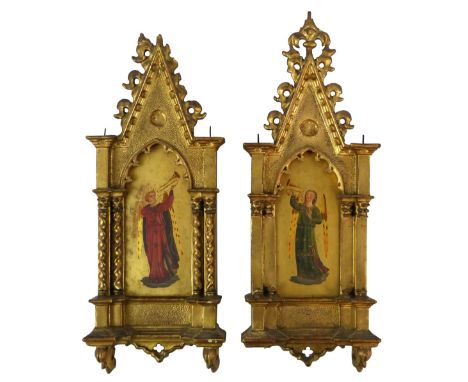 A pair of 19th century Italian School religious icons, each of an angel playing a musical instrument, mounted in a Gothic sty