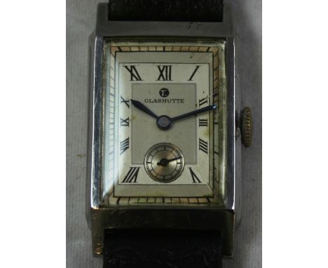 Tutima - a Glashutte rectangular manual wing gentleman's stainless steel  wristwatch, circa 1938, the silvered dial with blac