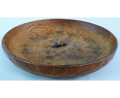 A Robert Mouseman Thompson of Kilburn adzed oak bowl, of shallow circular form carved with a mouse motif to the centre 30cm d