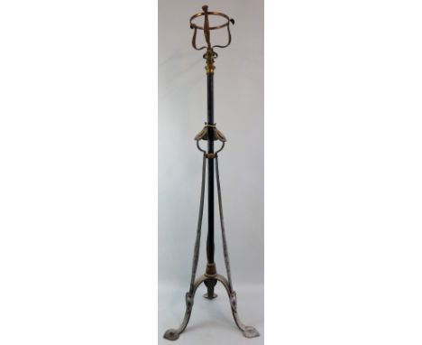 An Art Nouveau iron and brass standard lamp, the telescopic open cradle top on plain tubular stem with three mother-of-pearl 