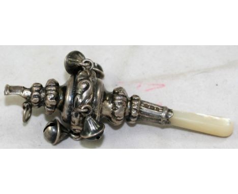 An Edwardian silver and mother of pearl rattle, Birmingham 1903, with embossed decoration and four bells, length 8 cm.