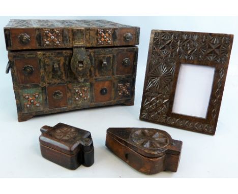 An Eastern iron-bound hardwood box, of oblong form with applied rounded and cross motifs, two carving handles and plain inter