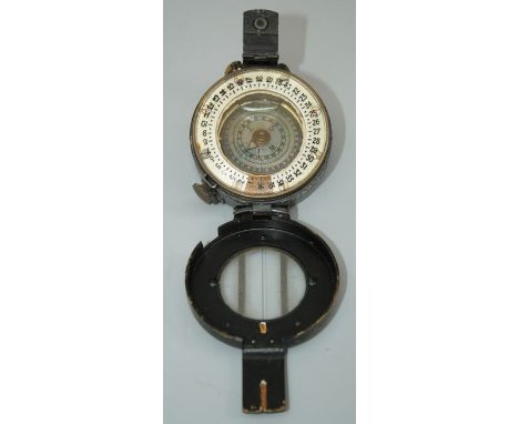 T G Co Ltd, a brass WWII marching compass, MKIII numbered B283658, 6cm diameter
