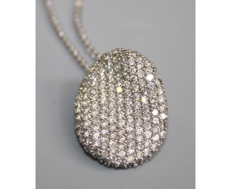 A 14K white gold oval diamond Pendant, pavé&nbsp;set over 140 round brilliant-cut diamonds,&nbsp;estimated&nbsp;total weight 