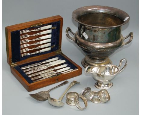 A 19th century silver plated campagna form wine cooler, an EPNS lazy Susan with gallery top, a cased set of six Mother of Pea