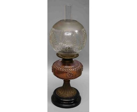 Wright and Butler, Birmingham, an Edwardian paraffin lamp with amethyst glass reservoir and etched shade on ceramic base, 55c