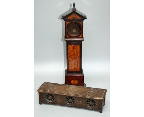 An Edwardian mahogany boxwood inlaid and floral marquetry miniature grandfather clock case, the architectural hood with provi