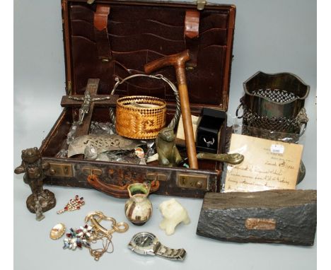 A small leather case containing various costume and paste set jewellery, ceiling light lustres, a fragment of HMS Victory tim