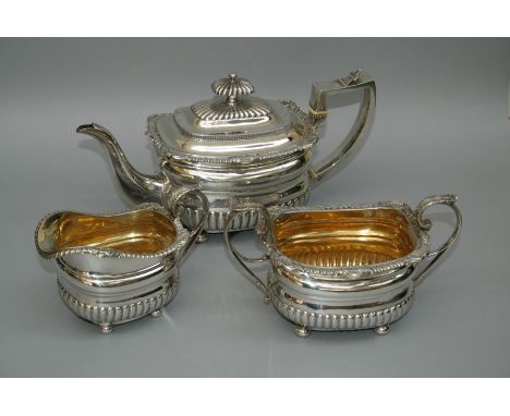 William Eaton, an early 19th century silver three piece tea service, of demi-reeded form with scallop cast rims, each on four