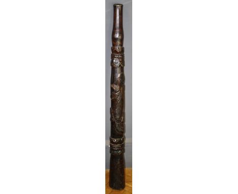 A circa 1970's didgeridoo, carved with reptile in shallow relief, 128cm