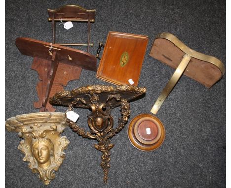 A moulded composition wall mounting corner bracket with trailing floral decoration, 33 x 30cm, another with mask, three home 
