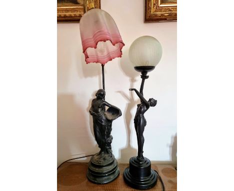 An Art Deco style lamp of a female holding a globe, along with a lamp depicting a classical female.&nbsp; &nbsp;Condition. Wo