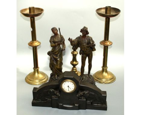 An Art Deco spelter mantle timepiece, decorated in relief with two panthers, 31cm, two spelter figures of Florentine musician