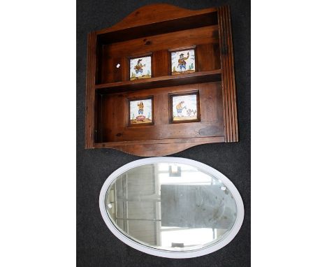 A two tier open wall shelf set with reproduction 18th century Dutch tiles, 92 x 90cm, together with an Edwardian oval wall mi