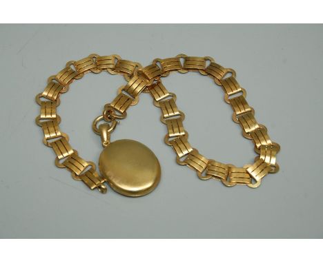 An unmarked yellow metal fancy chain suspending an oval locket, chain length approx 41cm, the locket approx  4.5cm inc the ba