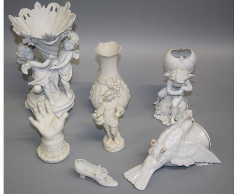 A parian group of amourini and cornucopia, 22cm, a Victorian parian cuffed hand, Copeland parian figure of an estate worker w