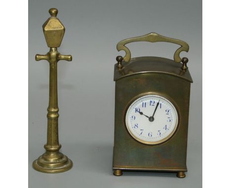 An early 20th century dome cased brass carriage clock with enamel Arabic dial, 14cm (handle up), together with a brass pocket