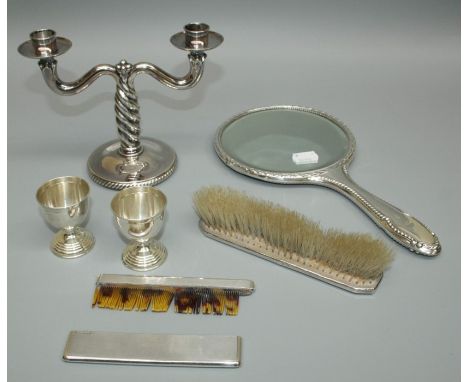 A wrythen form two branch table candlestick stamped sterling, 15cm, two .800 standard silver egg cups, a mappin and Webb silv