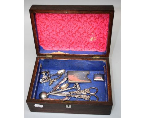 An Edwardian rosewood jewellery box containing various small silver and white metal items inclding a pair of long dog knife r