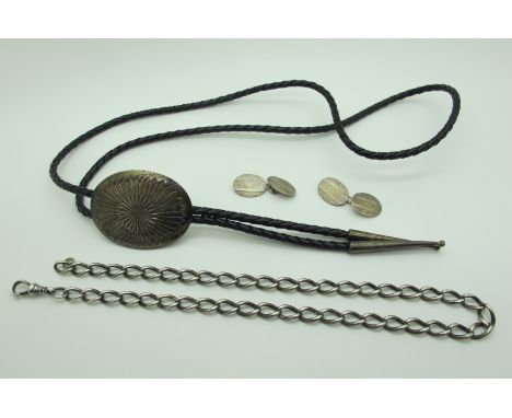 A Pair of Engine Turned Cufflinks, together with a curb link part Albert chain, an American Western style necklace. 