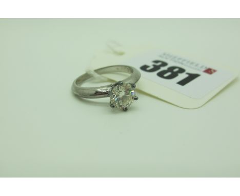 A Moissanite Single Stone Dress Ring, reference number to girdle "GRA 310294098", six claw set (finger size K). 