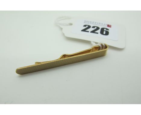 A 9ct Gold Tie Slide, with engine turned decoration (3.8grams). 