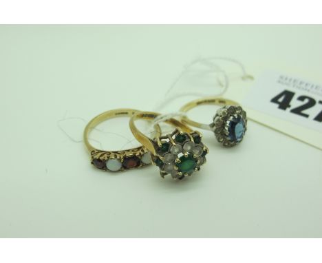 A 9ct Gold Cluster Dress Ring, (one stone missing) (finger size M); a smaller cluster dress ring, stamped "9ct &amp; Sil"; a 