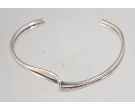 A 925 silver cuff bangle bracelet with wrap over twist decoration. Marked 925. Weight 14g.