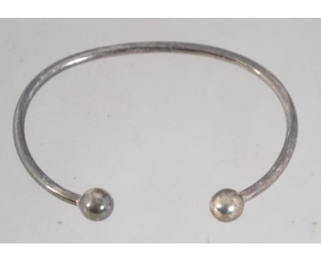 A 925 silver cuff bangle bracelet with ball finial decoration. Marked 925. Weight 9.6g.