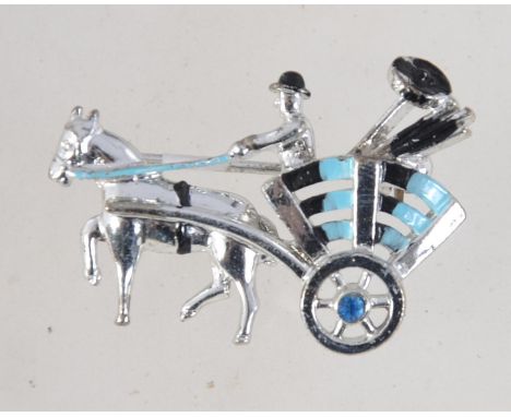 A vintage 1950's white metal enamelled figural brooch pin in the form of a man and cart (possible chimney sweep) with bezel s
