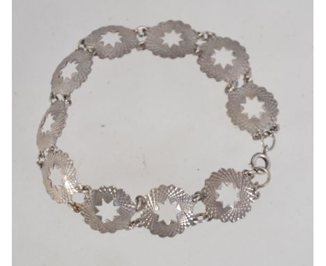 A vintage 1970 sterling silver bracelet with star panels and cut facets and bolt ring clasp. Marked Sterling. Measures 19cms.