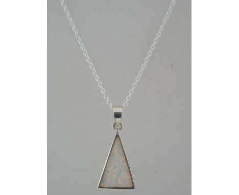 An Art Deco style silver & opal pendant and necklace chain having silver surround, clasp and chain. Weight 4.8g / Chain measu