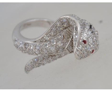 A fabulous silver and cz adorned snake charmer / snake ring with ruby garnet stone eyes. Total weight 13.5g / Size o.5