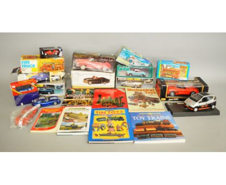 Nine boxed Tinplate models, including both friction and clockwork powered examples, together with a small quantity of diecast