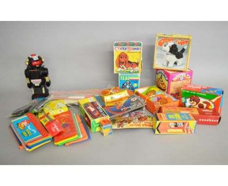 A varied selection of plastic and tinplate toys, mostly in original packaging, including a number vintage 'Made in Hong Kong'