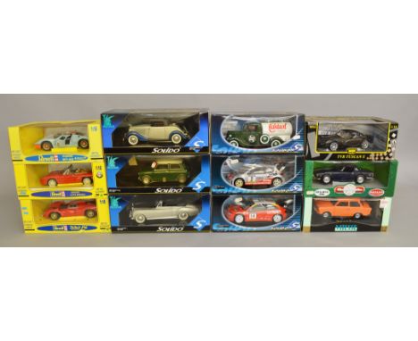 12 x assorted diecast models, mostly 1:18 scale cars, by Solido, Jouef and similar, including Ford, Ferrari, etc. Boxed and a