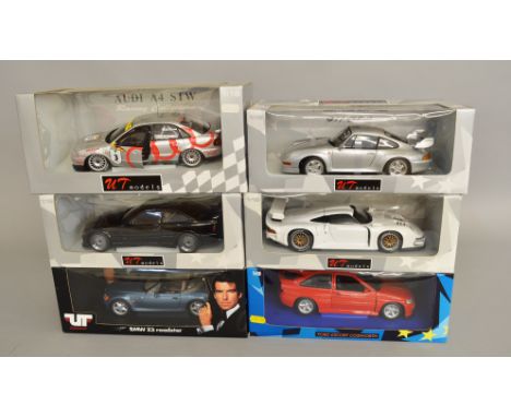 Six UT Models 1:18 scale diecast model cars, including: James Bond Goldeneye BMW Z3; BMW M3; Audi A4 STW; Porsche 911 GT2; Po