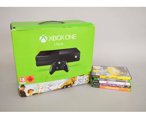 Xbox: Xbox console with two controllers. Along with four Xbox games and one Xbox one game. Contents not checked.