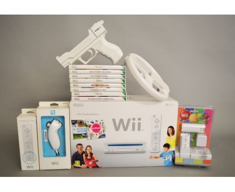 Nintendo Wii Family Edition console, together with eight games, steering wheel, gun, controller, Remote+ and twin charge dock